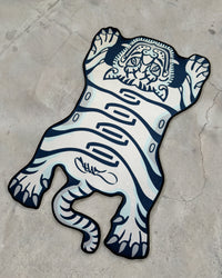 Blue Tuned Tiger rug laid flat on concrete