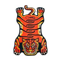 Orange Tuned Tiger rug laid flat on a black background