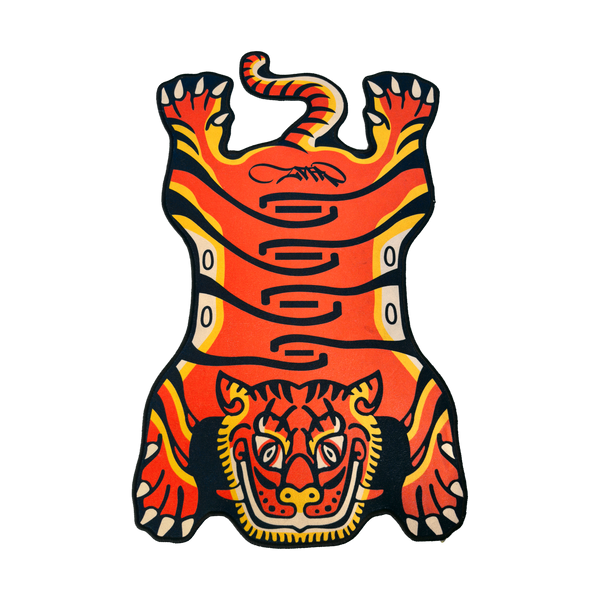 Orange Tuned Tiger rug laid flat on a black background